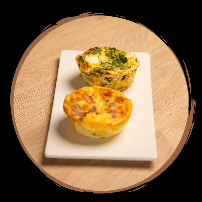 Freshly baked quiches on a serving plate